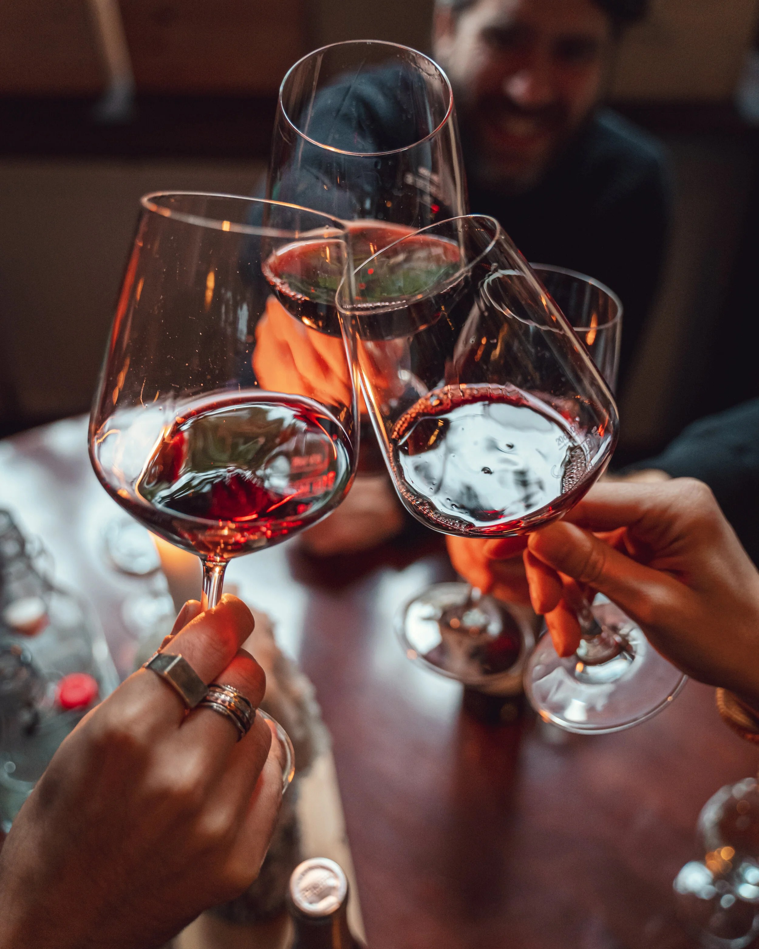 Friends clinking glasses of wine