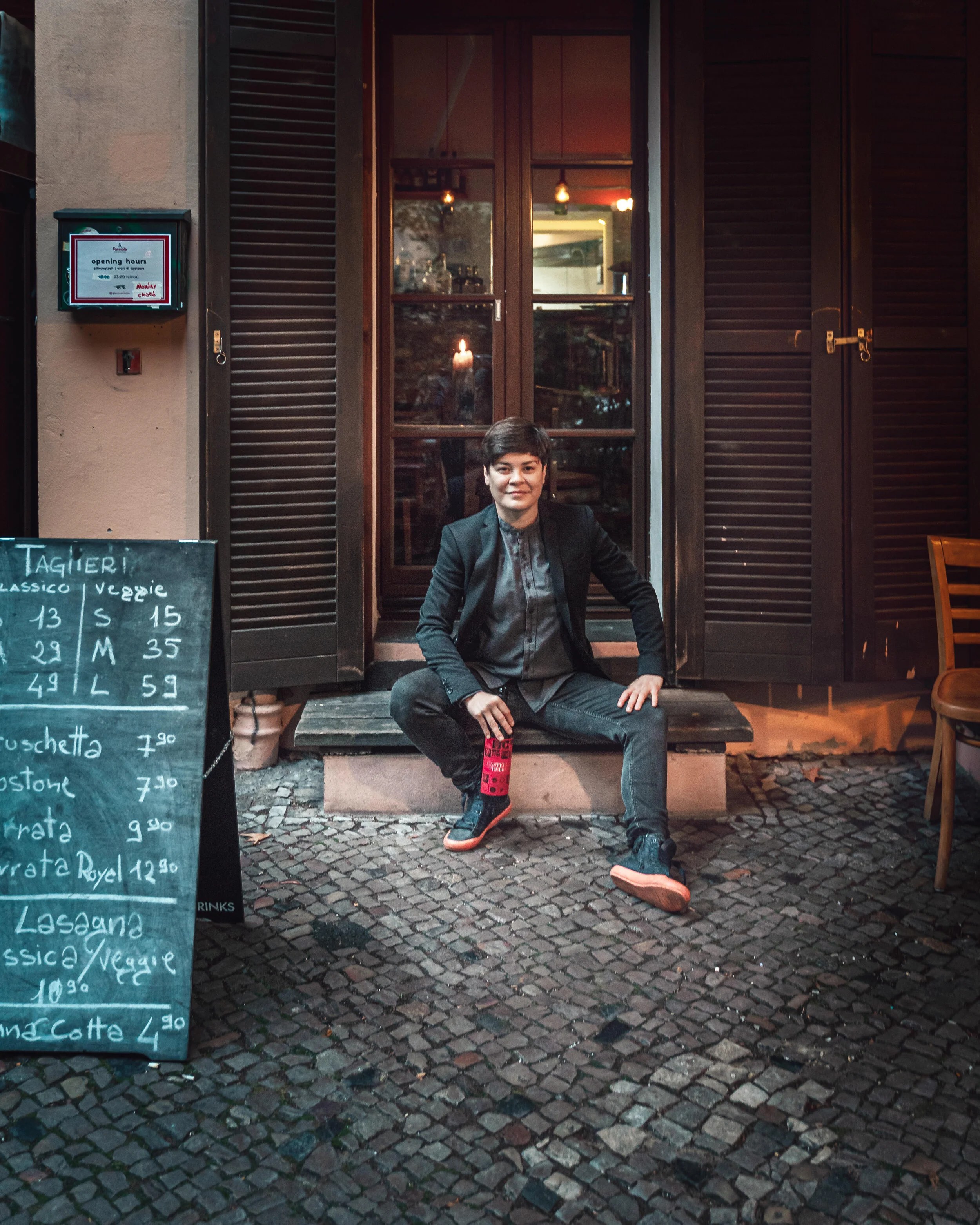 Auro sitting outside Facciola in Kreuzberg